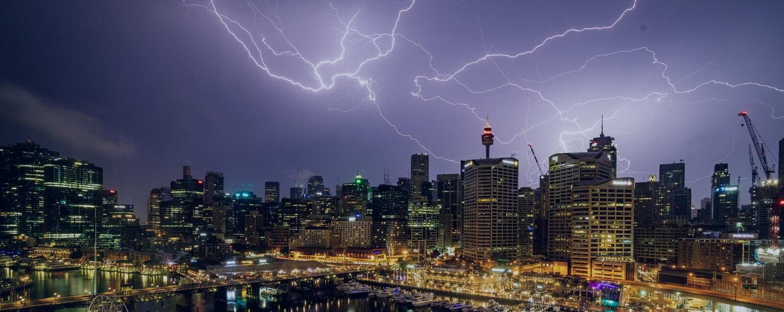COMTRADE Adapter: lightning over a city illustrating grid fault events